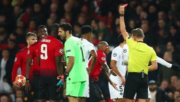 MANCHESTER, ENGLAND - FEBRUARY 12:  Referee Daniele Orsato shows a red card to Paul Pogba of Manchester United during the UEFA Champions League Round of 16 First Leg match between Manchester United and Paris Saint-Germain at Old Trafford on February 12, 2