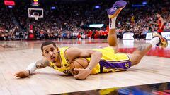 TORONTO, ON - DECEMBER 07: Juan Toscano-Anderson #95 of the Los Angeles Lakers grabs a loose ball against the Toronto Raptors during the first half of their NBA game at Scotiabank Arena on December 7, 2022 in Toronto, Canada. NOTE TO USER: User expressly acknowledges and agrees that, by downloading and or using this photograph, User is consenting to the terms and conditions of the Getty Images License Agreement.   Cole Burston/Getty Images/AFP (Photo by Cole Burston / GETTY IMAGES NORTH AMERICA / Getty Images via AFP)