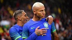 Brazil's forward Richarlison (R) celebrates after scoring his team's second goal during the friendly football match between Brazil and Tunisia at the Parc des Princes in Paris on September 27, 2022. (Photo by Anne-Christine POUJOULAT / AFP)