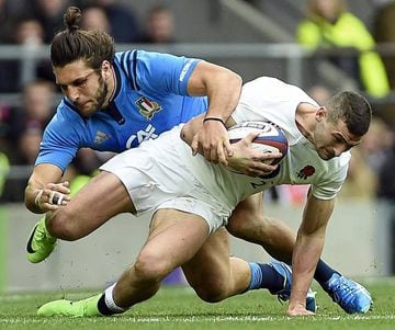 England's Jonny May is tackled by Italy's Luke McLean.