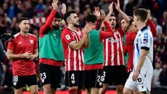 Athletic Bilbao players celebrate their win at the end of the Spanish league football match between Athletic Club Bilbao and Real Sociedad at the San Mames stadium in Bilbao on January 13, 2024. (Photo by ANDER GILLENEA / AFP)
