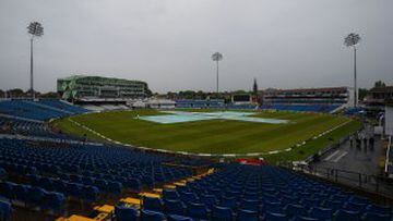 Covers sit over the wicket as rain halts play on the first day of the first cricket Test match between England and Sri Lanka at Headingley in Leeds, northern England on May 19, 2016.