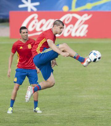 Morata jumps to bring the ball under control.
