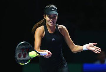 SINGAPORE - OCTOBER 24:  Ana Ivanovic of Serbia plays a forehand against Simona Halep of Romania in their round robin match during the BNP Paribas WTA Finals at Singapore Sports Hub on October 24, 2014 in Singapore.  (Photo by Clive Brunskill/Getty Images)