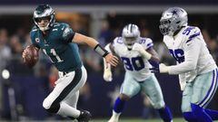 ARLINGTON, TX - NOVEMBER 19: Carson Wentz #11 of the Philadelphia Eagles is pursued by Maliek Collins #96 of the Dallas Cowboys in the first half of a football game at AT&amp;T Stadium on November 19, 2017 in Arlington, Texas.   Ronald Martinez/Getty Images/AFP == FOR NEWSPAPERS, INTERNET, TELCOS &amp; TELEVISION USE ONLY ==