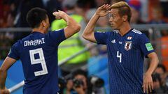 YEKATERINBURG, RUSSIA - JUNE 24:  Keisuke Honda of Japan celebrates with team mate Shinji Okasaki after equalising during the 2018 FIFA World Cup Russia group H match between Japan and Senegal at Ekaterinburg Arena on June 24, 2018 in Yekaterinburg, Russia.  (Photo by Mike Hewitt - FIFA/FIFA via Getty Images)