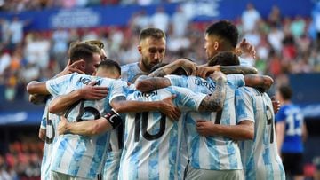 Argentina's forward Lionel Messi (C) celebrates with teammates after scoring his team's second goal during the international friendly football match between Argentina and Estonia at El Sadar stadium in Pamplona on June 5, 2022. (Photo by ANDER GILLENEA / AFP)