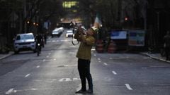 New York (United States), 09/04/2020.- A man blows a trumpet in the street during a citywide show of support, taking place each night at 7pm for essential workers on the frontlines of the current health crisis, in New York, New York, USA, 09 April 2020. N