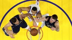 SAN FRANCISCO, CALIFORNIA - MAY 20: Otto Porter Jr. #32 of the Golden State Warriors shoots the ball against Maxi Kleber #42 and Luka Doncic #77 of the Dallas Mavericks