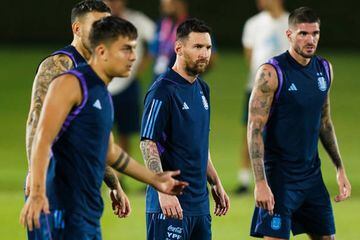 Lionel Messi (C) looks on during the Argentina Training Session at Al Khor SC 