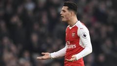 Arsenal&#039;s Granit Xhaka looks dejected after being sent off