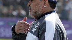Argentine former football star and new team coach of Gimnasia y Esgrima La Plata Diego Armando Maradona  gestures before the start of their Argentina First Division Superliga