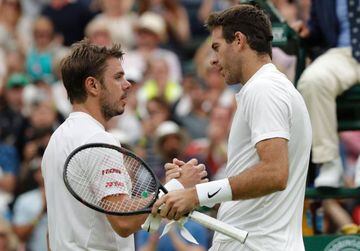 Switzerland's Stan Wawrinka shakes hands with Del Potro after losing their men's singles second round match.