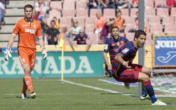 Luis Suárez reels away after putting Barcelona ahead in Granada.
