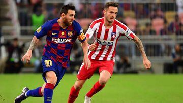 Barcelona&#039;s Argentine forward Lionel Messi (L) is marked by Atletico Madrid&#039;s Spanish midfielder Saul Niguez during the Spanish Super Cup semi final between Barcelona and Atletico Madrid on January 9, 2020, at the King Abdullah Sport City in the