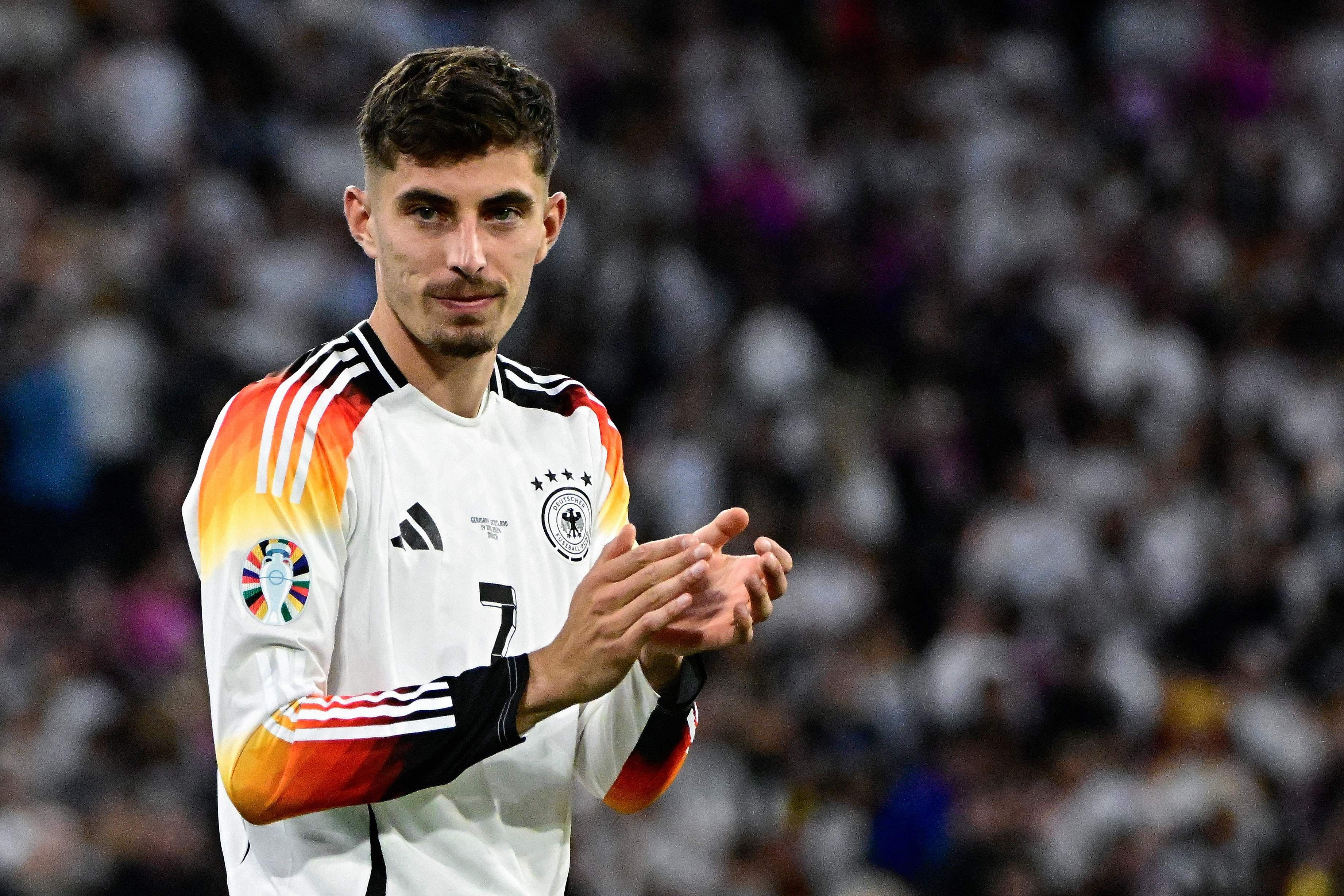 Germany's forward #07 Kai Havertz applauds the fans on the pitch after the UEFA Euro 2024 Group A football match between Germany and Scotland at the Munich Football Arena in Munich on June 14, 2024. Euro 2024 hosts Germany began their quest for a record fourth continental title with a comprehensive 5-1 win over 10-man Scotland. (Photo by Tobias SCHWARZ / AFP)