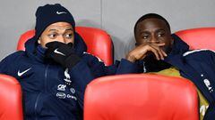 France&#039;s forward Kylian Mbappe (L) sits on the bench with France&#039;s midfielder Tanguy Ndombele during the Euro 2020 Group H football qualification match between Albania and France at the Air Albania Stadium in Tirana, on November 17, 2019. (Photo