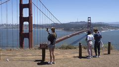 People take photos of the Golden Gate Bridge and the San Francisco skyline from the Battery Spencer after the Golden Gate National Recreation Area reopened in Sausalito, California, USA, 17 June 2020. The area had been closed for three months amid the cor
