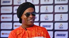 Former Brazilian football player Ronaldinho speaks to AFP during the World Teqball Championships at the Bangkok Arena in Bangkok on December 3, 2023. (Photo by Lillian SUWANRUMPHA / AFP)