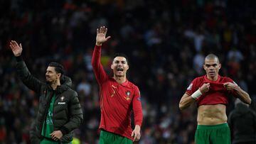 (LtoR) Portugal&#039;s defender Jose Fonte, Portugal&#039;s forward Cristiano Ronaldo and Portugal&#039;s defender Pepe wave to supporters at the end of the World Cup 2022 qualifying final first leg football match between Portugal and North Macedonia at t