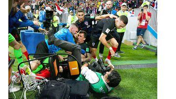 MOSCOW, RUSSIA - JULY 11:  Croatia players knock over a photograper as they celebrate after Mario Mandzukic of Croatia scores their team&#039;s second goal during the 2018 FIFA World Cup Russia Semi Final match between England and Croatia at Luzhniki Stad
