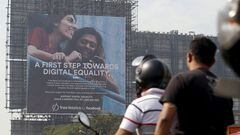 FILE PHOTO: Motorists ride past a billboard displaying Facebook's Free Basics initiative in Mumbai, India, December 30, 2015. REUTERS/Danish Siddiqui/File Photo