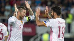 Spain&#039;s Diego Costa (R) celebrates with teammate Sergio Ramos after scoring a goal during the FIFA World Cup 2018 qualifying football match between Macedonia and Spain at Philip II of Macedon Stadium in Skopje on June 11, 2017. / AFP PHOTO / Robert A