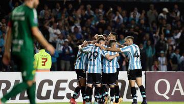 Argentina's Racing Carlos Alcaraz (covered) celebrates with teammates after scoring a goal against Brazil's Cuiaba during their Copa Sudamericana group stage first leg football match at the Presidente Juan Domingo Peron stadium in Buenos Aires, on April 13, 2022. (Photo by ALEJANDRO PAGNI / AFP) (Photo by ALEJANDRO PAGNI/AFP via Getty Images)