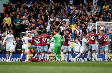 Leeds and Aston Villa players tussle after Mateusz Klich's controversial opening goal