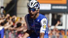 Colombia&#039;s Fernando Gaviria of team Quick-Step celebrates as he crosses the finish line to win the third stage of the 100th Giro d&#039;Italia, Tour of Italy, cycling race from Tortoli to Cagliari on May 7, 2017 in Sardinia.  / AFP PHOTO / Luk BENIES