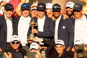 Captain Davis Love III of the United States celebrates Ryder Cup glory with vice-captains Jim Furyk, Bubba Watson, Tiger Woods and Tom Lehman.
