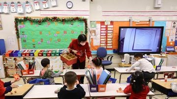 Principal Alice Hom hands out red envelopes and candy in a cultural celebration of the Lunar New Year.