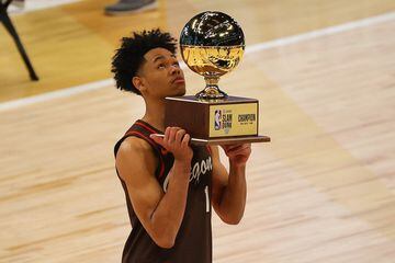 Anfernee Simons of the Portland TrailBlazers celebrates with the trophy after winning the Slam Dunk Contest during halftime of the NBA All-Star Game at State Farm Arena in Atlanta, Georgia.