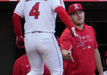 Jul 2, 2021; Anaheim, California, USA; Los Angeles Angels shortstop Jose Iglesias (4) is greeted by teammate Mike Trout after hitting a two-run home run in the second inning against the Baltimore Orioles at Angel Stadium. Mandatory Credit: Robert Hanashir