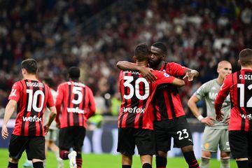 AC Milan's Brazilian midfielder Junior Messias (BACK) is congratulated by AC Milan's English defender Fikayo Tomori (C-R) during the Italian Serie A football match between AC Milan and Genoa 