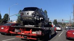 Tiger Woods&#039; smashed up SUV is loaded onto a flatbed truck and removed from California crash scene.