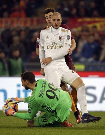 AC Milan's goalkeeper Gianluigi Donnarumma makes a save.