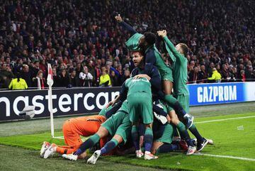 Tottenham players celebrate their win over Ajax in Amsterdam.