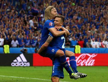 Traustason (right) celebrates with Birkir Bjarnason after scoring Iceland's winner.