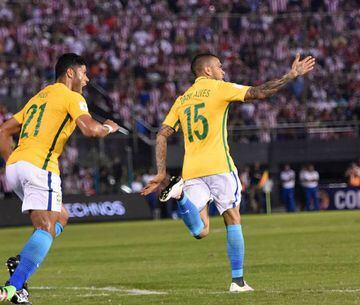 Brazil's Dani Alves (right) celebrates after grabbing the equaliser against Paraguay in Asunción.