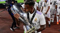 Real Madrid's Brazilian forward Rodrygo celebrates with the trophy after the UEFA Super Cup football match between Real Madrid vs Eintracht Frankfurt in Helsinki, on August 10, 2022. - Real Madrid won the match 2-0. (Photo by JAVIER SORIANO / AFP) (Photo by JAVIER SORIANO/AFP via Getty Images)