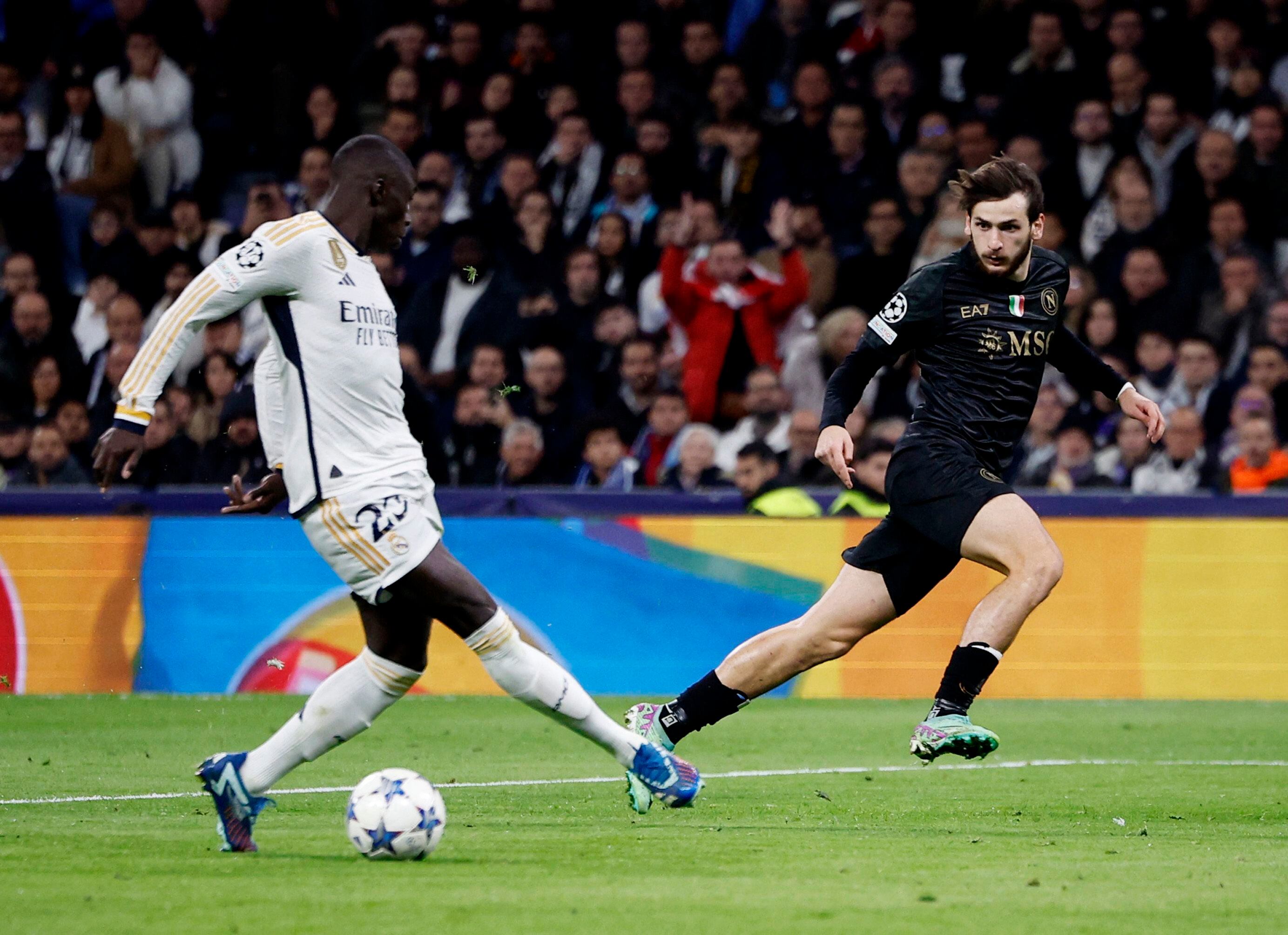 Soccer Football - Champions League - Group C - Real Madrid v Napoli - Santiago Bernabeu, Madrid, Spain - November 29, 2023 Napoli's Khvicha Kvaratskhelia in action with Real Madrid's Ferland Mendy REUTERS/Juan Medina