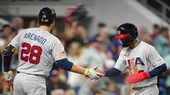 MIAMI, FLORIDA - MARCH 18: Mookie Betts #3 of the United States is congratulated by Nolan Arenado #28 after scoring during the first inning of a 2023 World Baseball Classic Quarterfinal game against Venezuela at loanDepot park on March 18, 2023 in Miami, Florida.   Eric Espada/Getty Images/AFP (Photo by Eric Espada / GETTY IMAGES NORTH AMERICA / Getty Images via AFP)