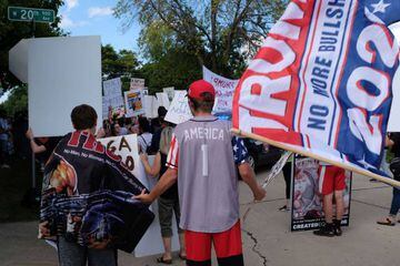 Donald Trump protesters and supporters interact on August 17, 2020 in Oshkosh, Wisconsin. Trump brought his campaign to Wisconsin, on the same day as Democrats held their virtual National Convention in Milwaukee.
