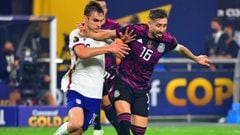 Mexico midfielder Hector Herrera (16) fends off USA defender James Sands (16) during the CONCACAF Gold Cup final soccer match at Allegiant Stadium.