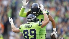 SEATTLE, WASHINGTON - SEPTEMBER 12: Will Dissly #89 and Colby Parkinson #84 of the Seattle Seahawks celebrate a touchdown scored by Parkinson during the second quarter against the Denver Broncos at Lumen Field on September 12, 2022 in Seattle, Washington.   Steph Chambers/Getty Images/AFP
