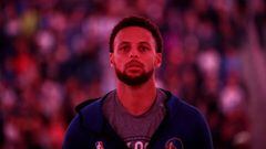 (FILES) In this file photo taken on March 08, 2020 Stephen Curry #30 of the Golden State Warriors stands for the Canadian National Anthem before their game against the Toronto Raptors at Chase Center on March 5, 2020 in San Francisco, California. - NBA pl