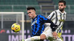 Lautaro Martinez and Rodrigo Bentancur go for the ball during the Italian Serie A football match Inter vs Juventus at the San Siro stadium in Milan.