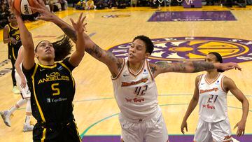 Phoenix Mercury center Brittney Griner (42) blocks a shot by Los Angeles Sparks guard Dearica Hamby (5)