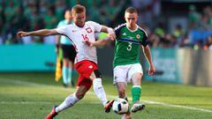 NICE, FRANCE - JUNE 12: Jakub Blaszczykowski of Poland and Shane Ferguson of Northern Ireland compete for the ball during the UEFA EURO 2016 Group C match between Poland and Northern Ireland at Allianz Riviera Stadium on June 12, 2016 in Nice, France.  (Photo by Lars Baron/Getty Images)
